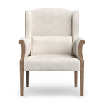Front view of an Armchair with a solid Oak frame in a vintage oak finish, with seating upholstered in a natural linen fabric and the exterior upholstered in a brown Burlap Hessian from the Manning range by the House of Curators